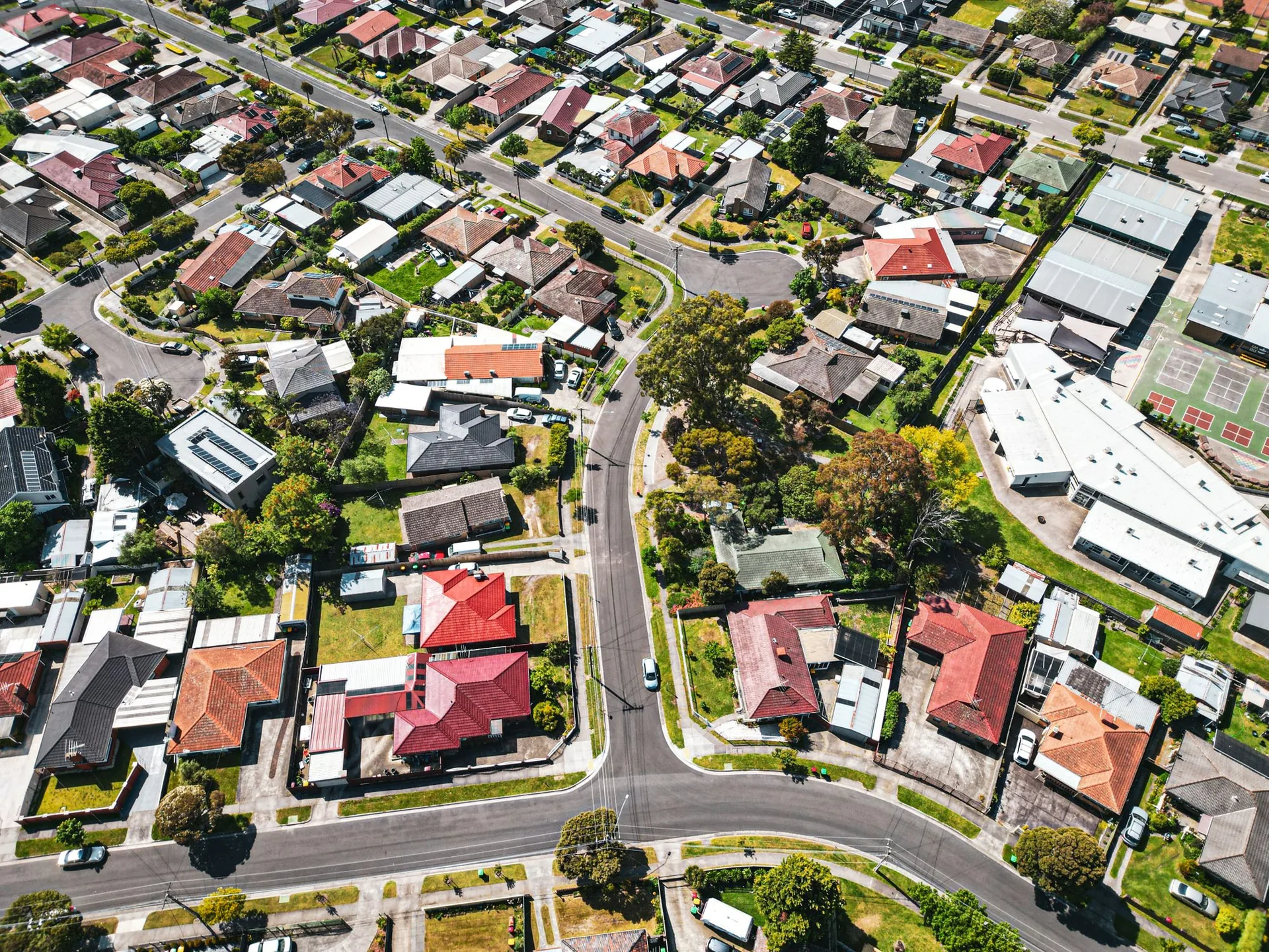 Top-down aerial view of an Australian suburban street grid showing houses, backyards, and lot boundaries