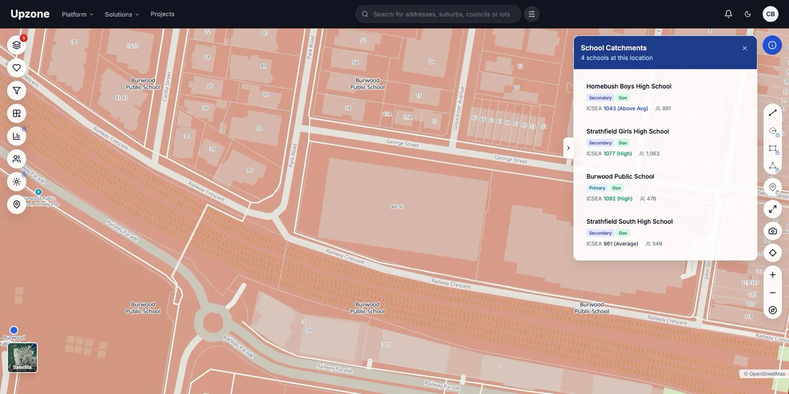 A school-catchment boundary highlighted on the map around Burwood, with a panel listing four government schools at this location: Homebush Boys High, Strathfield Girls High, Burwood Public and Strathfield South High, each with its ICSEA score and enrolment.